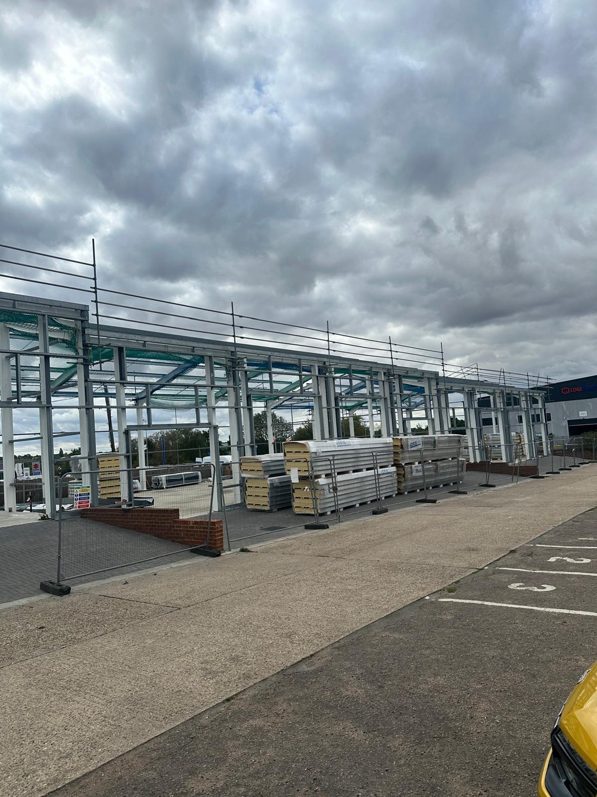 Steel portal frame under construction at Springwood Court, Springwood Industrial Estate, Braintree, designed in Tekla and erected by UDM