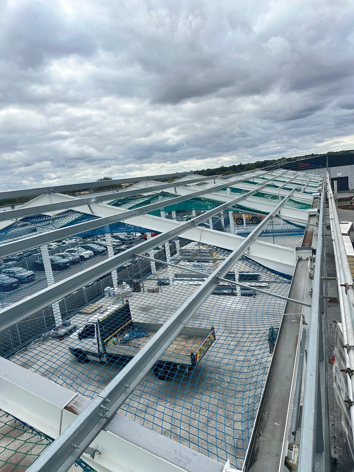 Steel rafters and safety netting on the Tekla-designed Springwood Court frame