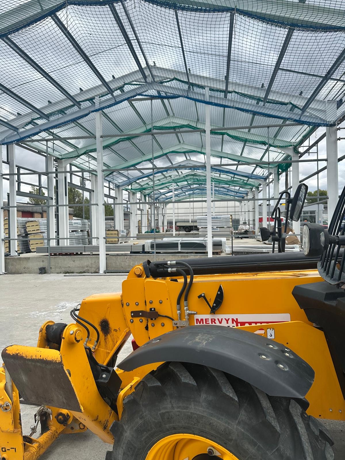 Telehandler working under the steel frame at Springwood Court, Springwood Industrial Estate, Braintree